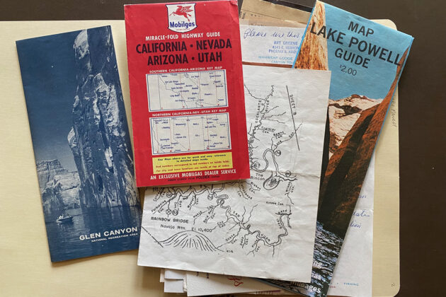Photograph of several pamphlets and a small map of areas in California, Nevada, Arizona and Utah including Glenn Canyon and Lake Powell.
