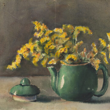 Watercolor study of green teapot with yellow flowers. The teapot is positioned on a flat surface slightly to the right of the center of the page, the yellow flowers are placed in the teapot, which serves as a makeshift vase. The teapot lid is lying to the left of the teapot. The background is done in a dark gray green and the flat surface in the foreground is a light tan color.