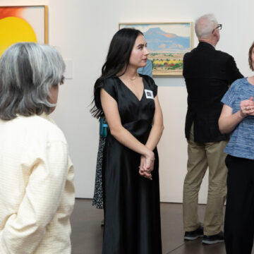 Three individuals in conversation