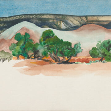 Horizontal watercolor of New Mexico landscape with trees in front of two small hills in the middle ground, while the foreground is unpainted white paper. The background is an expansive vista of a tree-dotted mesa and a clear blue sky.