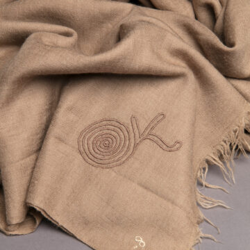 Scarf, Brown with GOK Monogram. Georgia O'Keeffe Museum. Gift of Juan and Anna Marie Hamilton. [2000.6.64] © Georgia O'Keeffe Museum. Photographed by Addison Doty